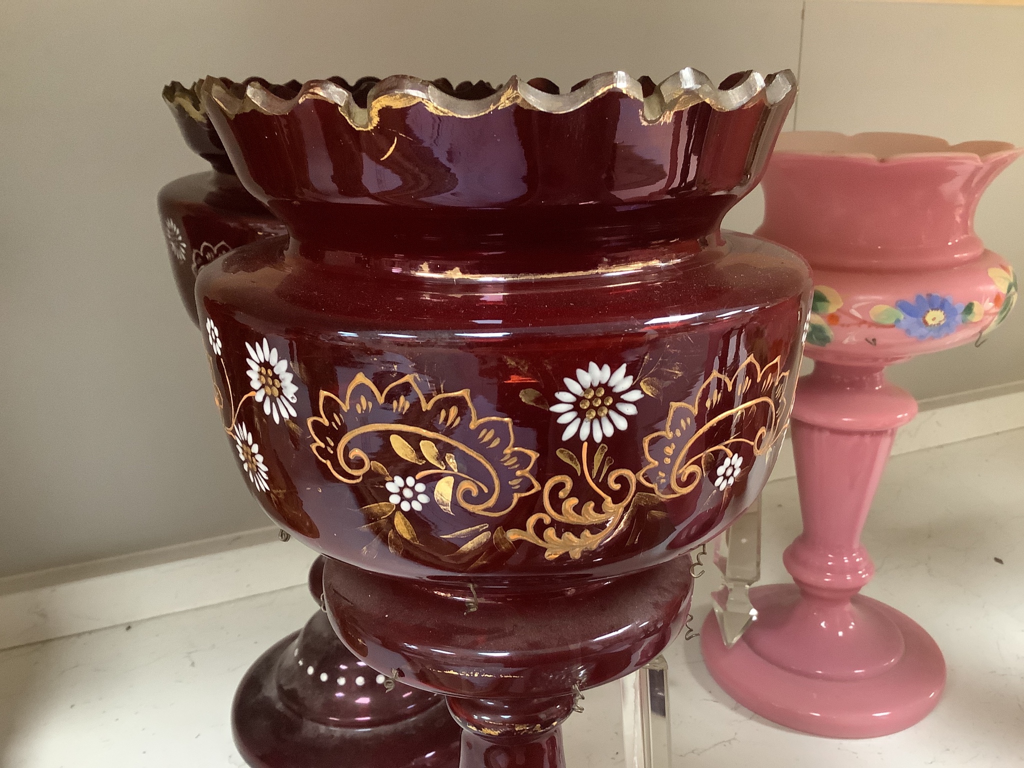 Two pairs of enamelled glass table lustres and another similar, late 19th century, tallest 36 cm